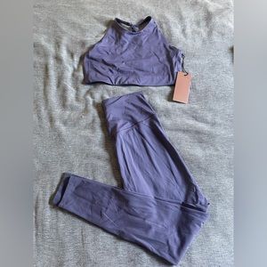 Brand new workout yoga set by girlfriend collective. Pants size M, bra size L